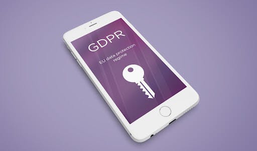 Mobile phone showcasing GDPR in the lockscreen with a white key on a purple background.
