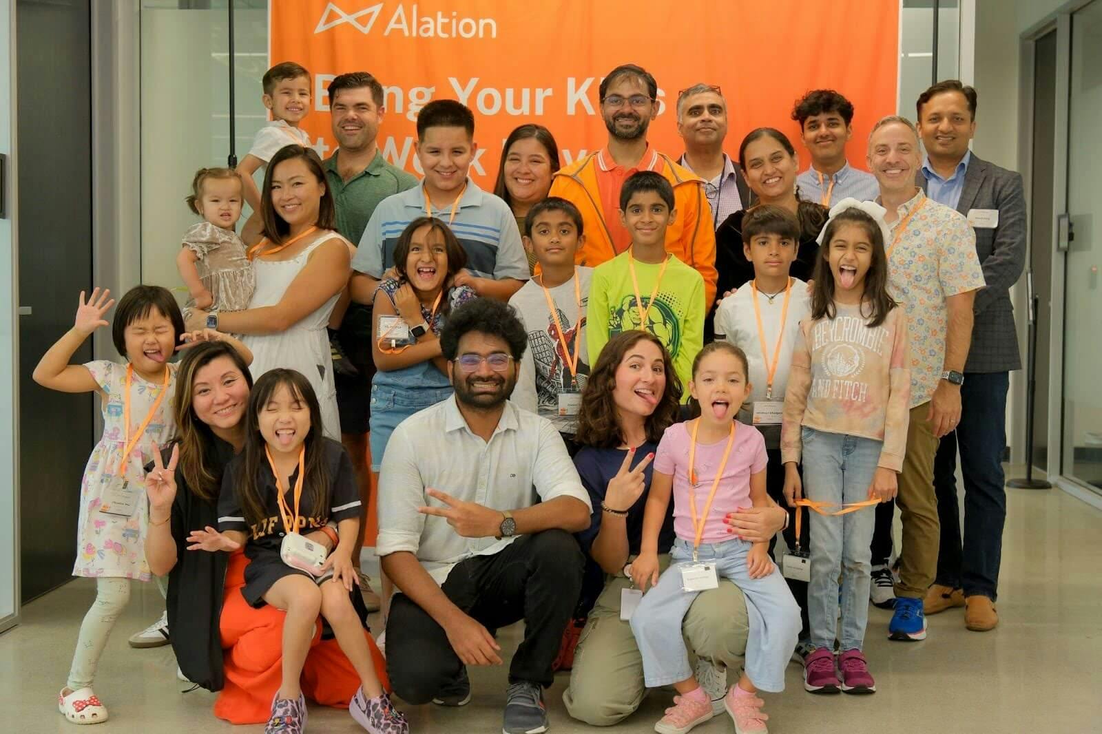 Photo showing Alationauts with their kids on Bring Your Kids to Work Day.