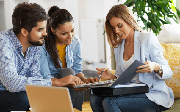 A real estate agent talking with a couple