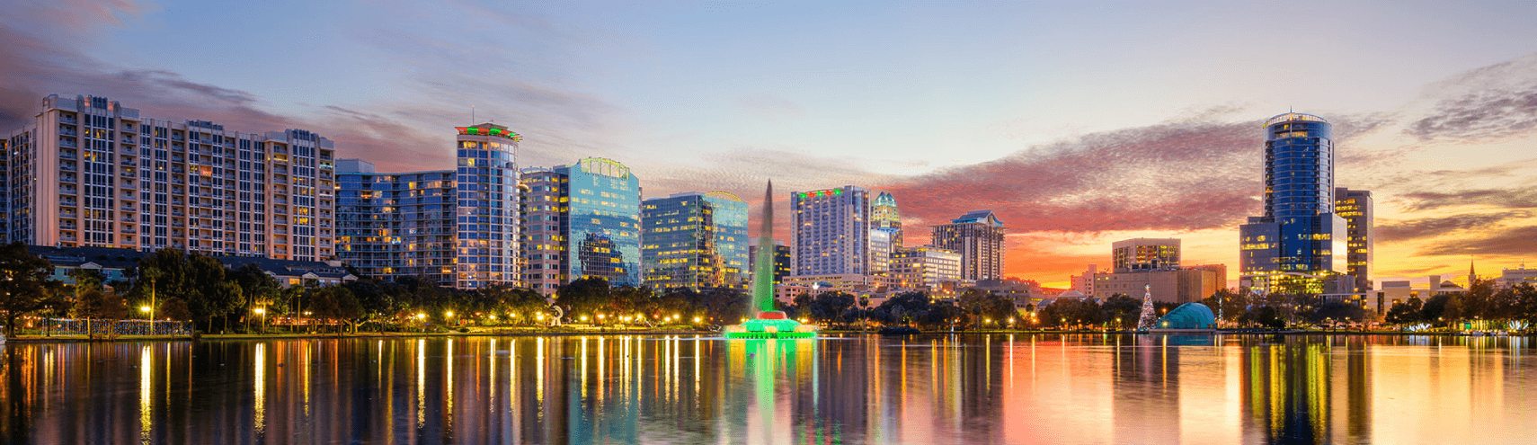 Alation Blog Image: City landscape of Orlando Florida as the sun is starting to set and the city lights are starting to shine.