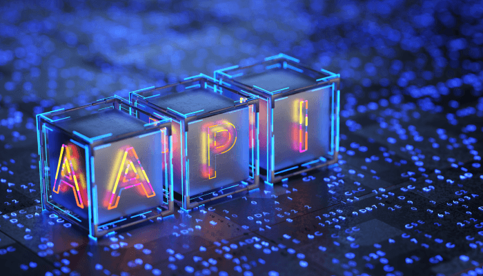 Alation blog image: Three-dimensional glass blocks spelling out 'API' with a neon glow, placed on a digital circuit board background, symbolizing advanced technology and software integration.