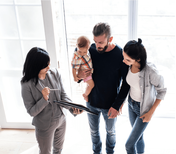Alation customer case study image: An agent showing a house to a couple with a child