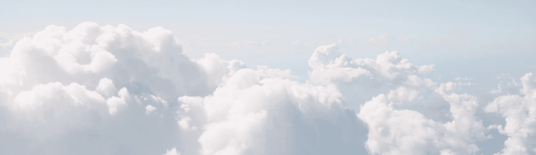 A cluster of clouds in the sky representing cloud data warehouse migration