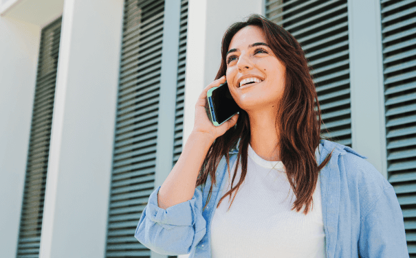 Alation Blog Image: A woman talking on a cellphone