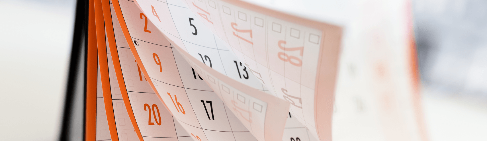 A calendar flipping through the pages showcasing Alation's 2022 highlights along the months of the year