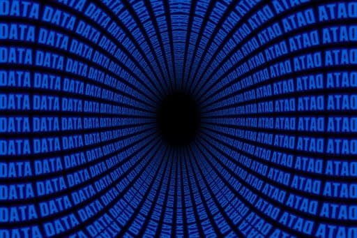 Alation blog image: Captivating illustration as the word "Data" gracefully spirals into the abyss of a mysterious black hole
